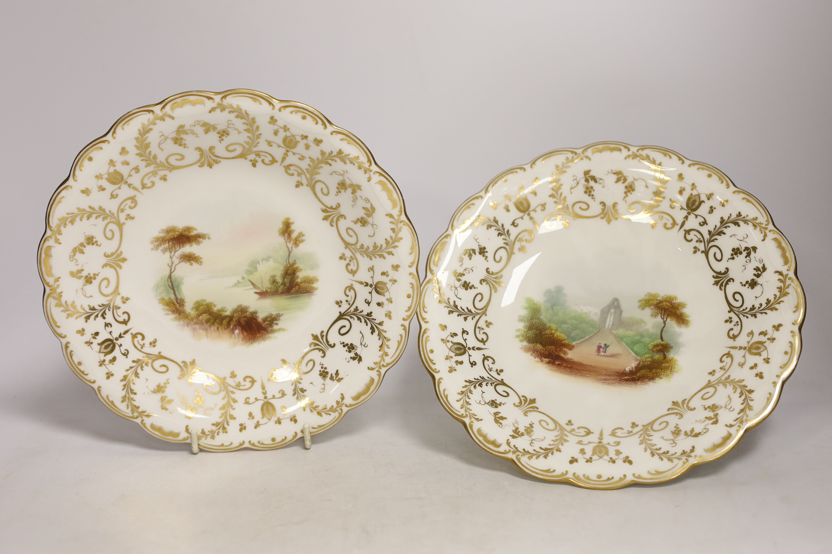 A Minton porcelain landscape painted dessert service, c.1850